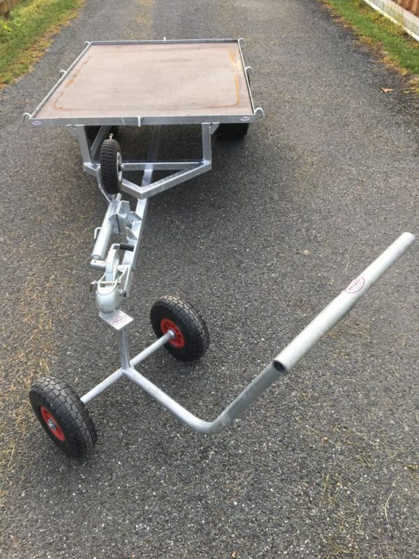 Trolley puller with small flat bed trailer